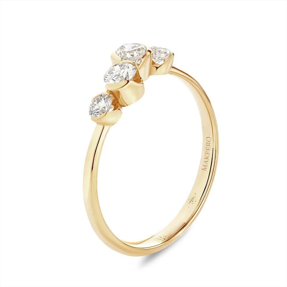 Yellow gold ring with four round diamonds, 3.4 mm each, set in a flowing band design