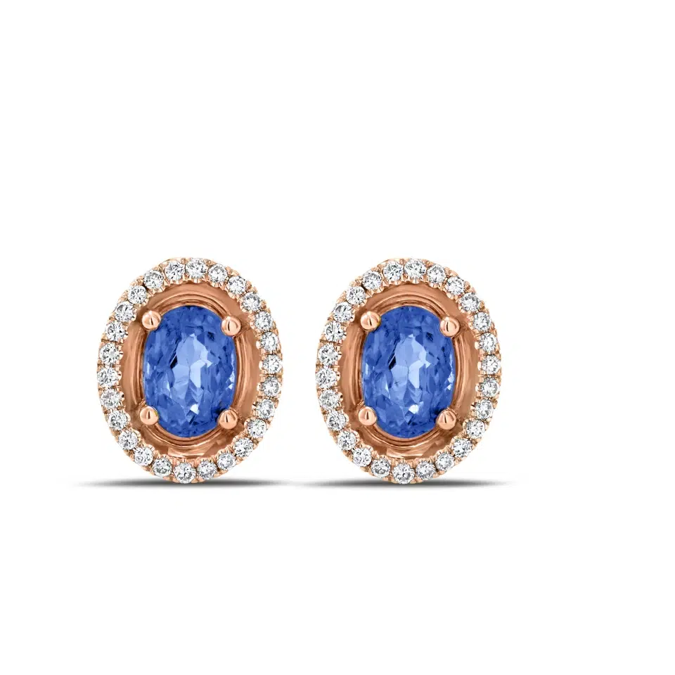 Pair of Aurore earrings in 18K white gold with oval tanzanites and a diamond halo