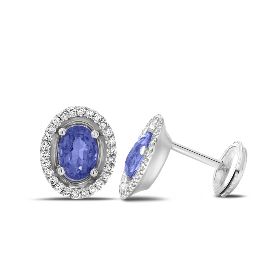 Pair of Aurore earrings in 18K white gold with oval tanzanites and a diamond halo