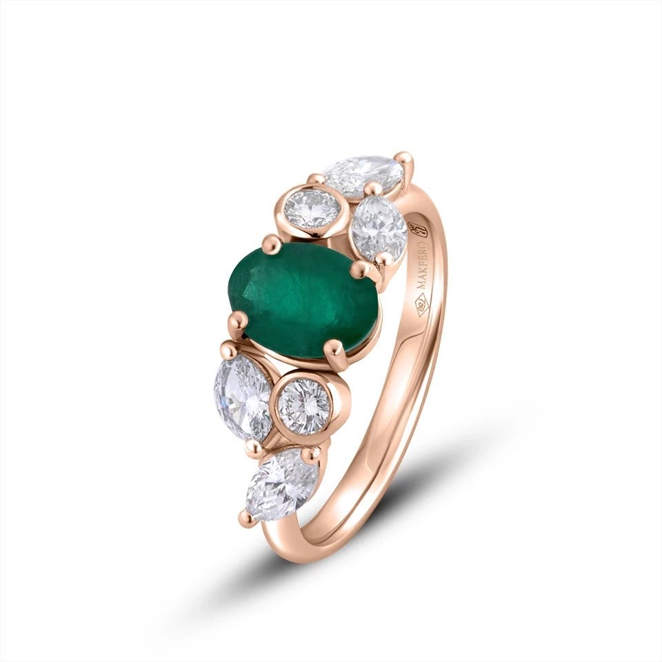 Rose gold ring with an oval emerald, 7.75 × 5.75 mm, two round diamonds, and four marquise diamonds in a floral design