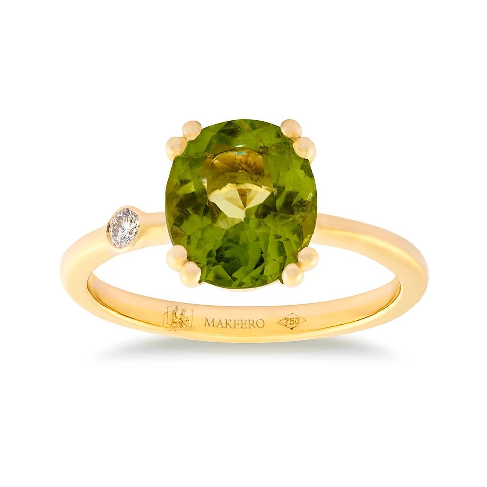 Yellow gold ring with oval peridot and a single round diamond set on the band