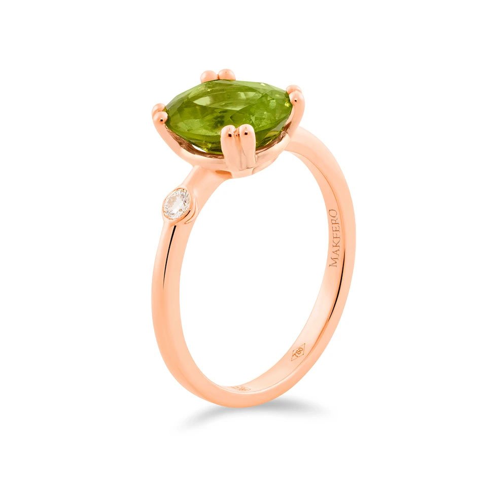 Rose gold ring with oval peridot and a single round diamond set on the band
