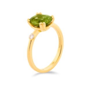 Yellow gold ring with oval peridot and a single round diamond set on the band