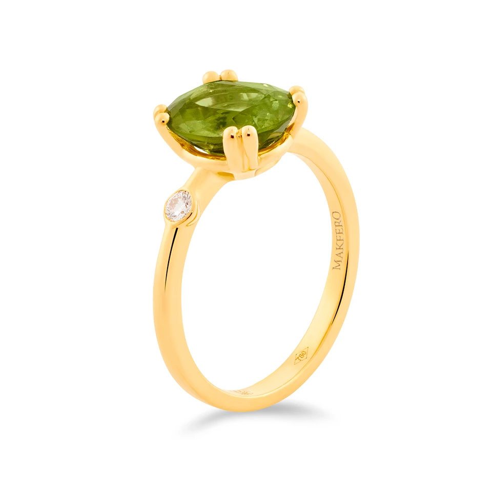 Yellow gold ring with oval peridot and a single round diamond set on the band