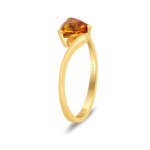 Yellow gold ring with curved band set with a triangular trillion-cut tourmaline