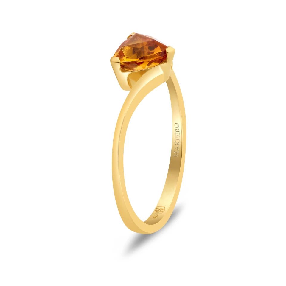 Yellow gold ring with curved band set with a triangular trillion-cut tourmaline