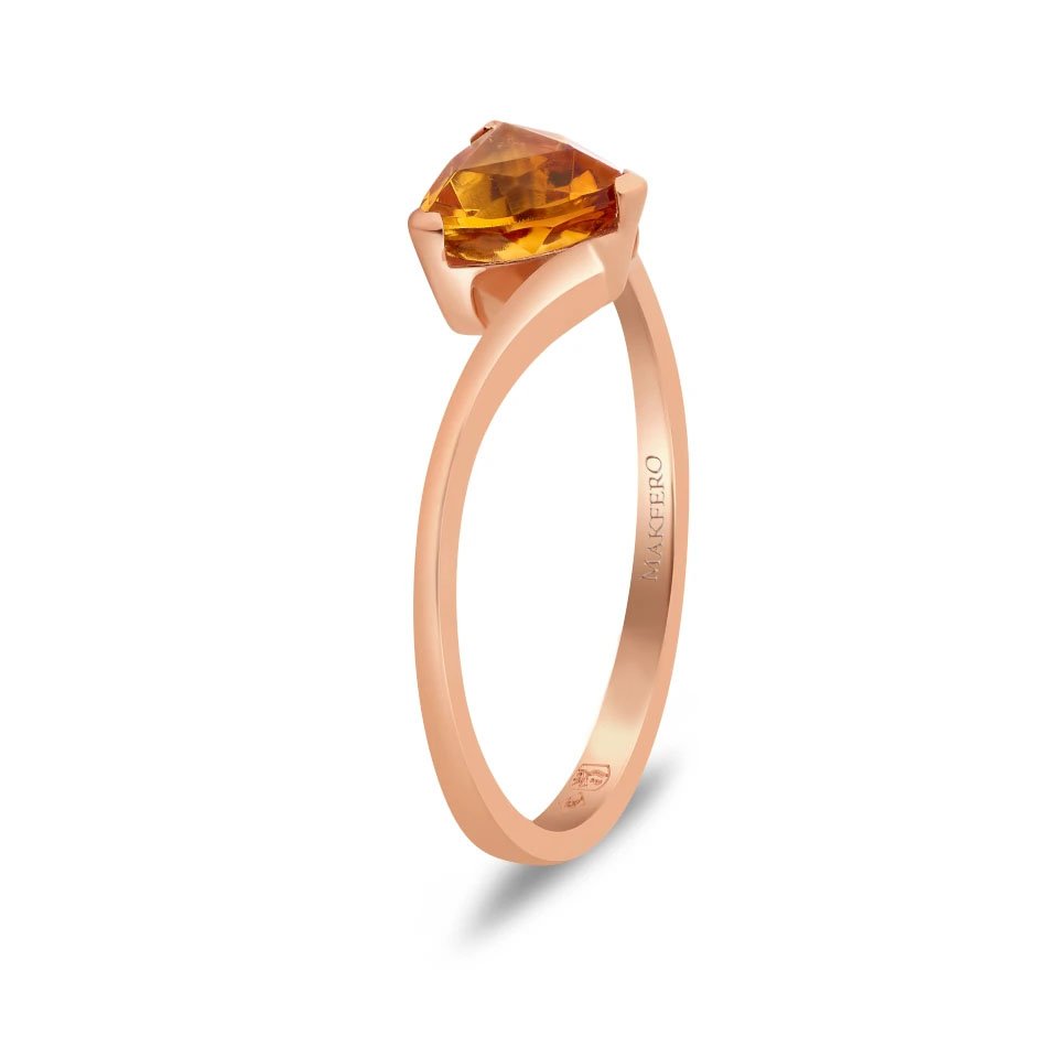 Rose gold ring with curved band set with a triangular trillion-cut tourmaline