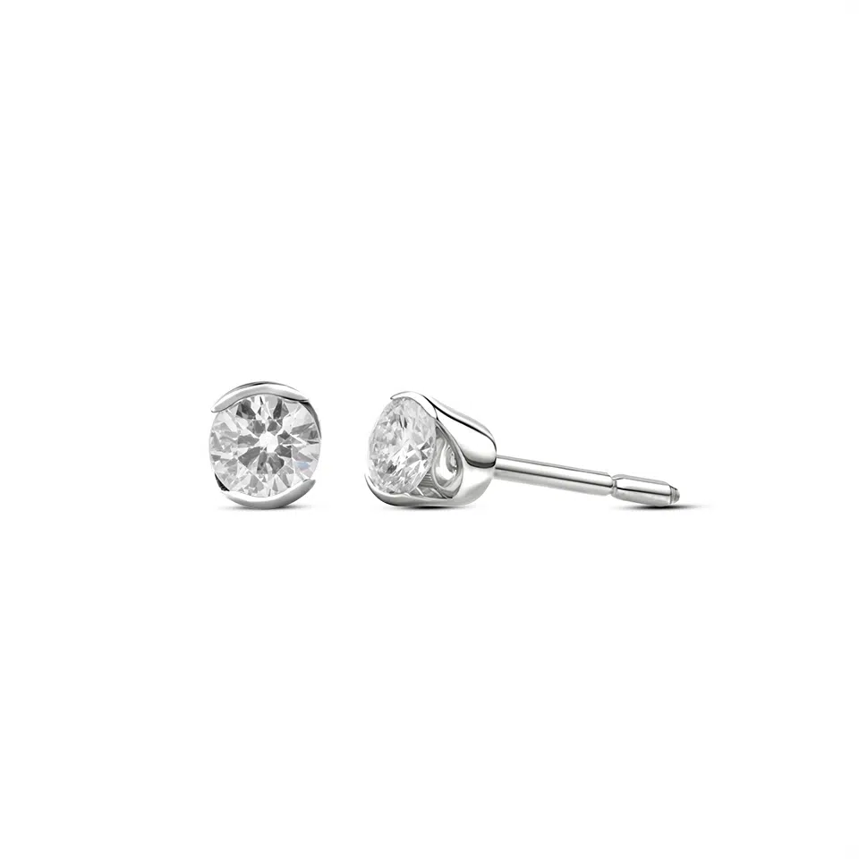 Pair of Prélude earrings in 18K white gold set with two round brilliant diamonds