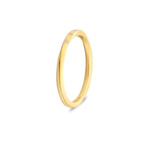 Yellow gold wedding band with five scattered round diamonds, set along a slim curved band