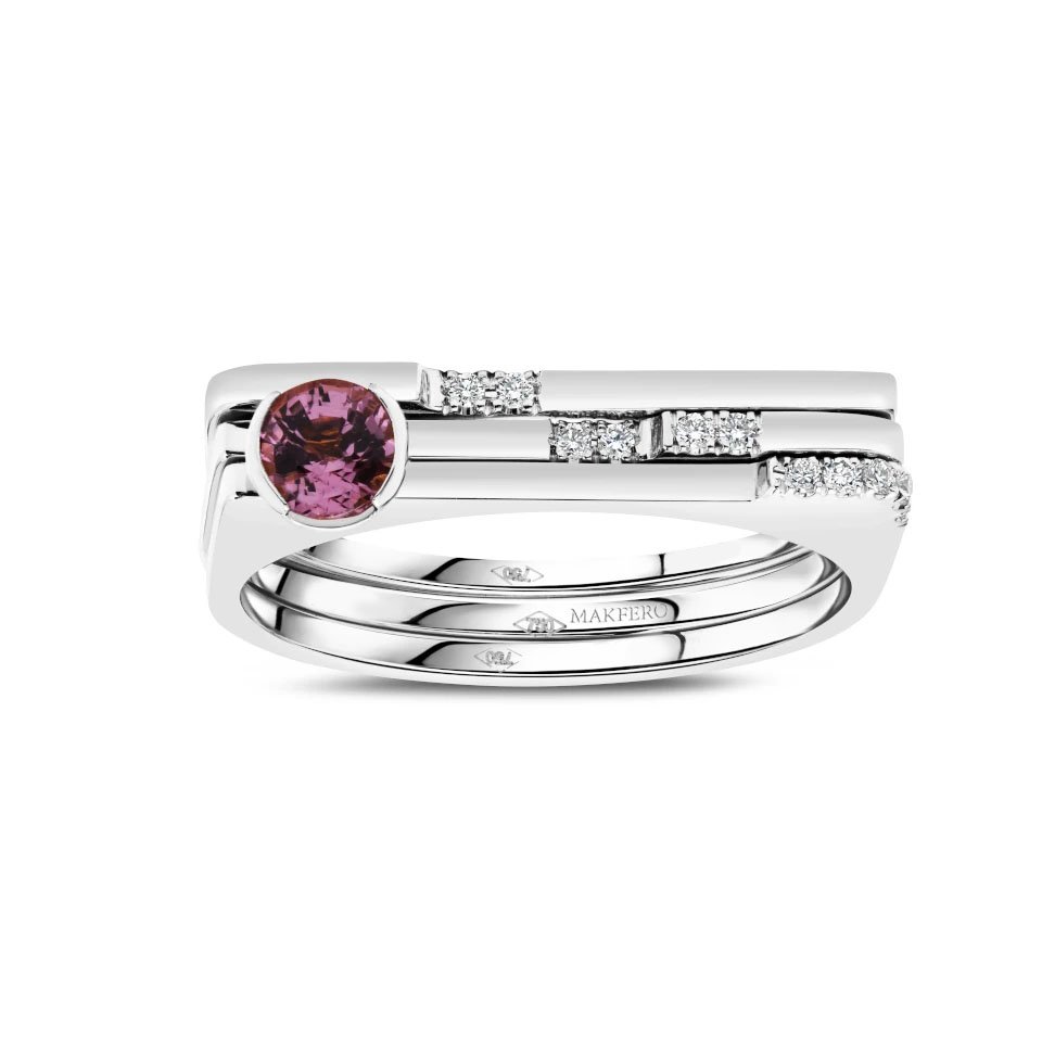 White gold ring combining tourmaline center stone with eleven small round diamonds set in a geometric modern band