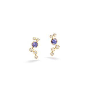 Chrysalia earrings in 18K yellow gold featuring round tanzanites surrounded by a cascade of round diamonds in a delicate asymmetrical design.