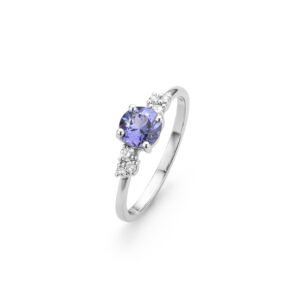 Yellow gold ring with a round tanzanite center stone and three diamonds on each side